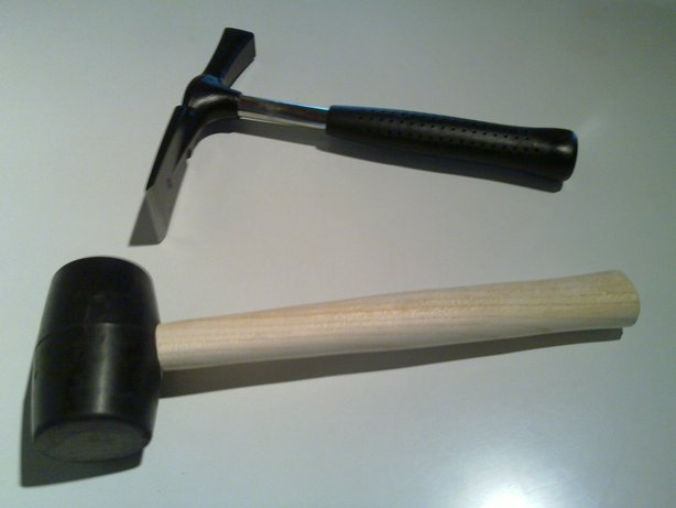 Masons hammer and rubbert-coated mallet